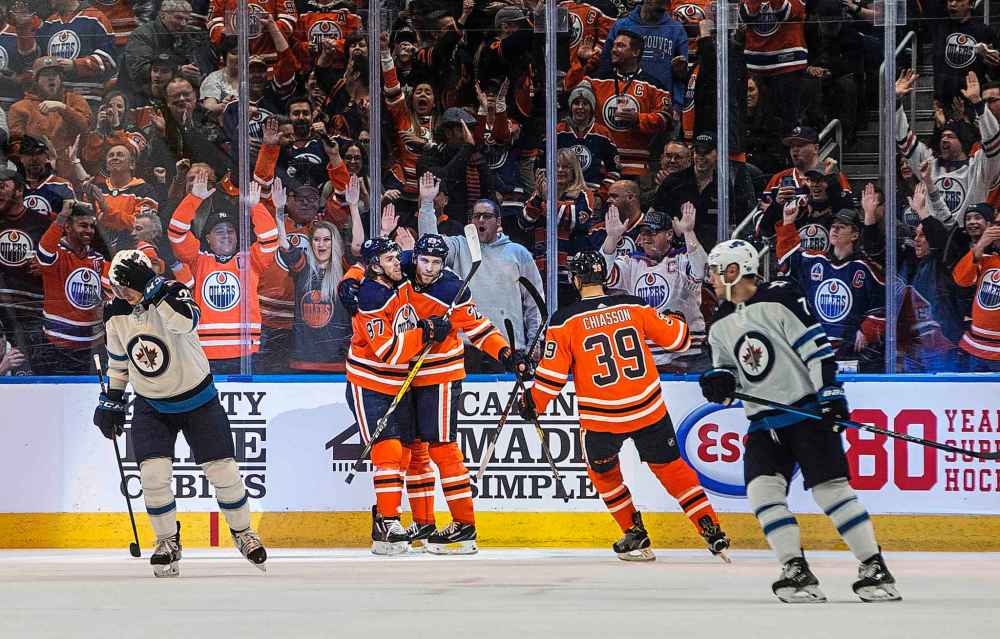 Edmonton Oilers' Connor McDavid (97), Leon Draisaitl (29) and Alex Chiasson (39) celebrate a goal during the first period. (Jason Franson / The Canadian Press)