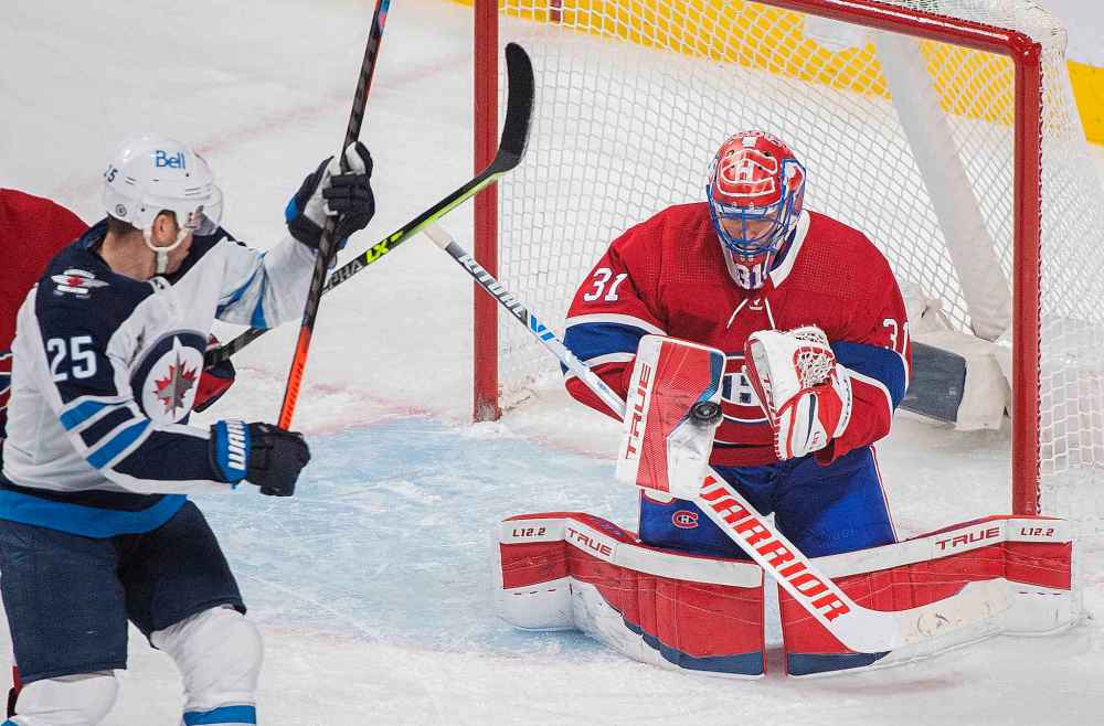 Montreal Canadiens goaltender Carey Price makes a save as Winnipeg Jets’ Paul Stastny moves in for the rebound during the first period. (Graham Hughes / The Canadian Press)