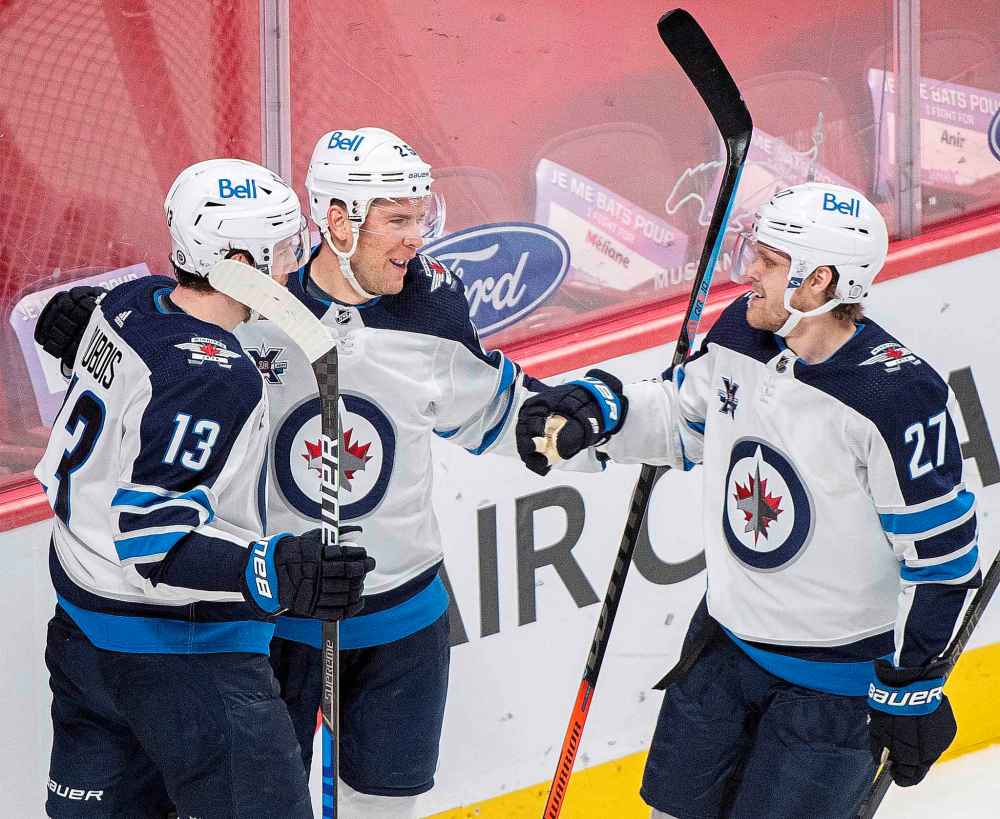 CP
Winnipeg Jets' Paul Stastny (25) celebrates his goal with teammates Pierre-Luc Dubois (13) and Nikolaj Ehlers (27) during the second period. (Graham Hughes / The Canadian Press)
