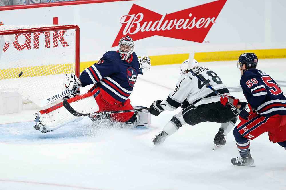 CP
Los Angeles Kings' Brendan Lemieux (48) scores on Winnipeg Jets goaltender Connor Hellebuyck (37) as Mark Scheifele (55) defends during the second period. (John Woods / The Canadian Press)
