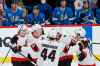 Ottawa Senators' Mike Reilly (5), Brady Tkachuk (7), Erik Gudbranson (44), Connor Brown (28) and Chris Tierney (71) celebrate TkachukÕs game winning goal against the Winnipeg Jets 8.2 seconds left in third period NHL action in Winnipeg on Saturday, February 13, 2021. (John Woods / The Canadian Press)
