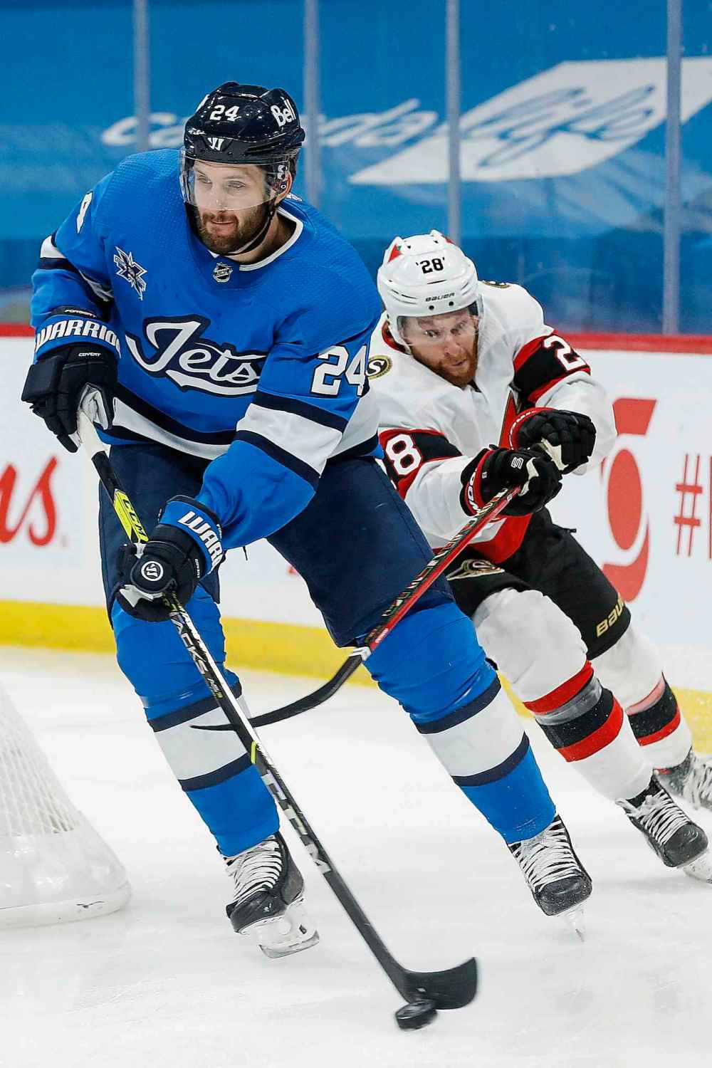 Ottawa Senators' Connor Brown (28) chases Winnipeg Jets' Derek Forbort (24) during the first period. (John Woods / The Canadian Press)