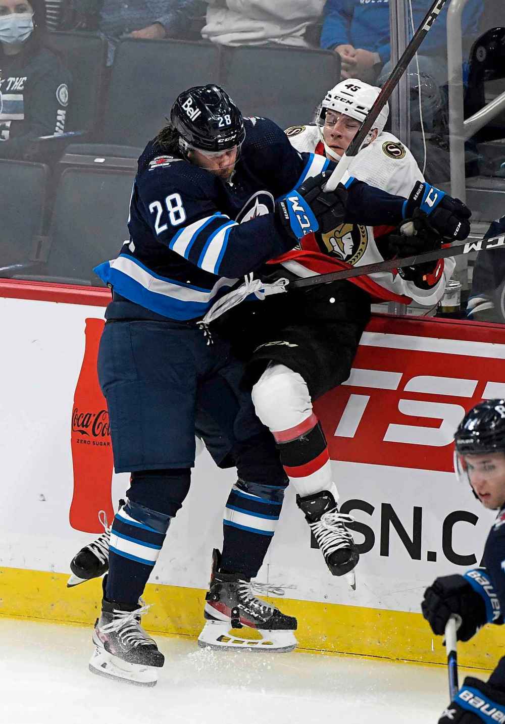 CP
Winnipeg Jets' Nathan Beaulieu (28) checks Ottawa Senators’ Parker Kelly (45) during the first period. (Fred Greenslade / The Canadian Press)