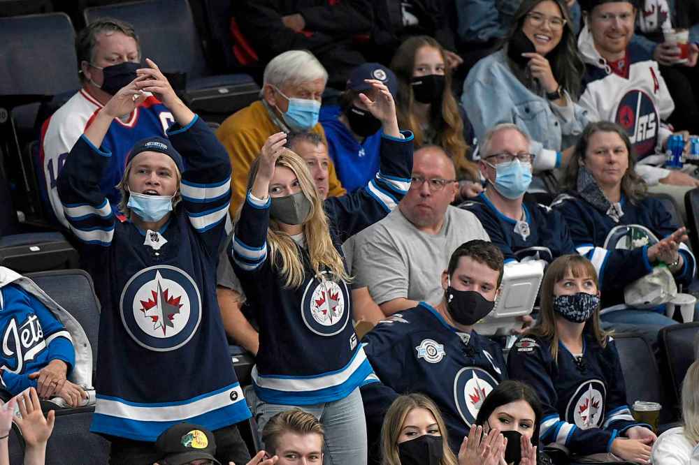 CP
Winnipeg Jets' fans cheer on during the first period. (Fred Greenslade / The Canadian Press)