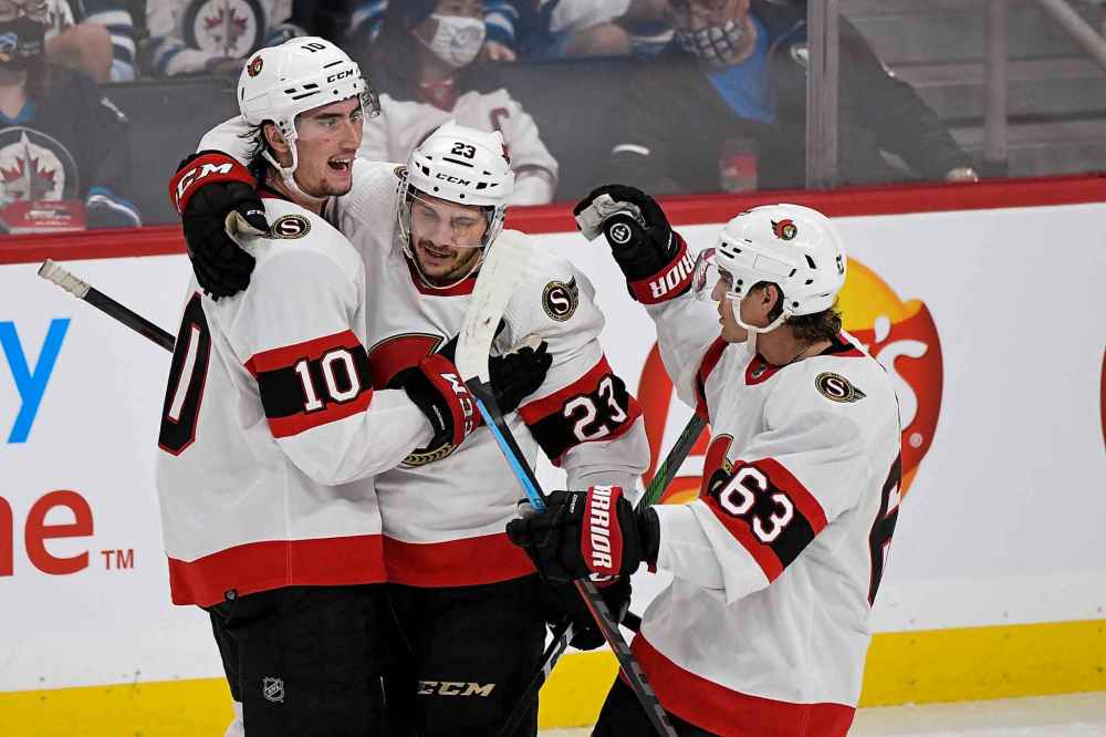CP
Ottawa Senators’ Alex Formenton (10) celebrates his goal with teammates Andrew Agozzino (23) and Tyler Ennis (63) during the third period. (Fred Greenslade / The Canadian Press)