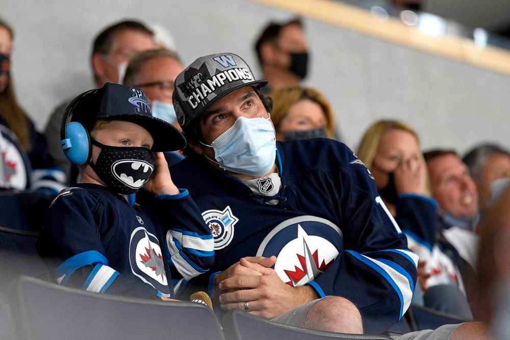CP
Winnipeg Jets' fans look on during the first period. (Fred Greenslade / The Canadian Press)