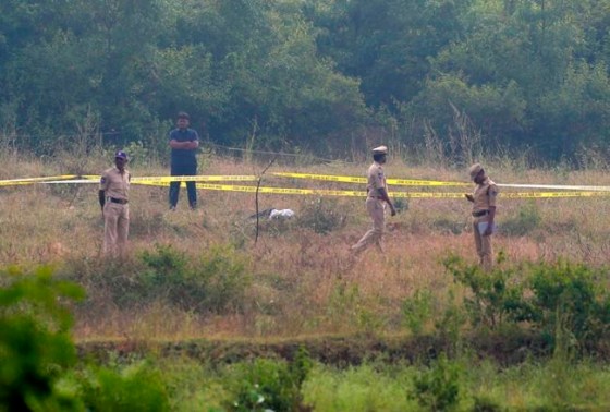 Indian policemen stand guard the area where rape accused were shot on the outskirts of Chattanpally in Shadnagar some 50 kilometers or 31 miles from Hyderabad, India, Friday, Dec. 6, 2019. An Indian police official says four men accused of raping and killing a woman in southern India have been fatally shot by police. (AP Photo/Mahesh Kumar A.)