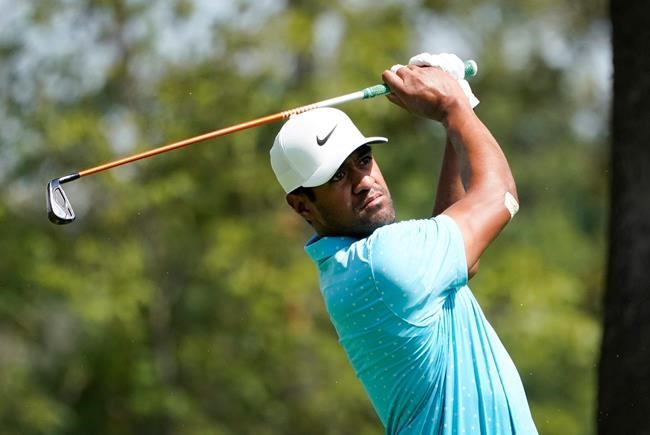 Tony Finau hits from the 12th tee during the first round of the BMW Championship golf tournament, Thursday, Aug. 27, 2020, at Olympia Fields Country Club in Olympia Fields, Ill. (AP Photo/Charles Rex Arbogast)