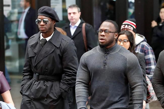 Brothers Olabinjo Osundairo, left, and Abimbola Osundairo arrive at the Leighton Criminal Courthouse in Chicago on Monday, Feb. 24, 2020 where actor Jussie Smollett made an appearance on a new set of charges alleging that he lied to police about being targeted in a racist and homophobic attack in downtown Chicago early last year. The brothers claim Smollett hired them to stage an attack on him. (AP Photo/Charles Rex Arbogast)