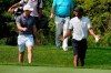 Rory McIlroy, left, and Tiger Woods talks as they head down the first hole during a practice round Wednesday, Aug. 26, 2020, for the BMW Championship golf tournament at the Olympia Fields Country Club in Olympia Fields, Ill. (AP Photo/Charles Rex Arbogast)
