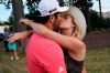 Jon Rahm, left, celebrates with his wife, Kelley Cahill, after finishing the final round of the BMW Championship golf tournament at the Olympia Fields Country Club in Olympia Fields, Ill., Sunday, Aug. 30, 2020. (AP Photo/Charles Rex Arbogast)
