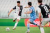 Juventus' Cristiano Ronaldo, left, and Lazio's Lucas Leiva compete for the ball during the Italian Serie A soccer match between Juventus and Lazio at the Allianz stadium in Turin, Italy, Monday, July 20, 2020. (Marco Alpozzi/LaPresse via AP)