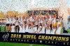 The North Carolina Courage celebrate with the championship trophy following their win over the Chicago Red Stars in an NWSL championship soccer game in Cary, N.C., on October 27, 2019. The National Women's Soccer League moved a step closer to resuming play by announcing Monday that players can start training in small groups providing it is done under league protocols and meets the requirements of local authorities. THE CANADIAN PRESS/AP - Karl B DeBlaker