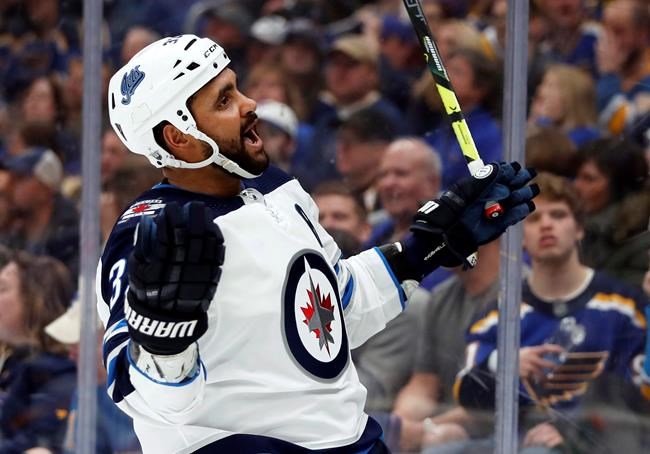 Winnipeg Jets' Dustin Byfuglien celebrates after scoring during the third period in Game 3 of an NHL first-round hockey playoff series against the St. Louis Blues in St. Louis on April 14, 2019. The Winnipeg Jets and defenceman Dustin Byfuglien have agreed to a mutual contract termination, bringing an end to a strained relationship between the team and a former face of the franchise. The NHL and the NHL Players' Association made the announcement Friday. THE CANADIAN PRESS/AP, Jeff Roberson