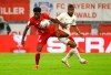 Bayern Munich's Alphonso Davies in action with Eintracht Frankfurt's Almamy Toure during the German soccer cup semi-final match between Bayern Munich and Eintracht Frankfurt in Munich, Germany, Wednesday, June 10, 2020. THE CANADIAN PRESS/AP, Kai Pfaffenbach - POOL