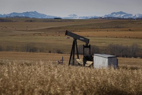 A de-commissioned pumpjack is shown at a well head on an oil and gas installation near Cremona, Alta., on October 29, 2016. Observers praised the federal government's multibillion-dollar oilpatch bailout package Friday, but warned the money should come with strings attached. 
