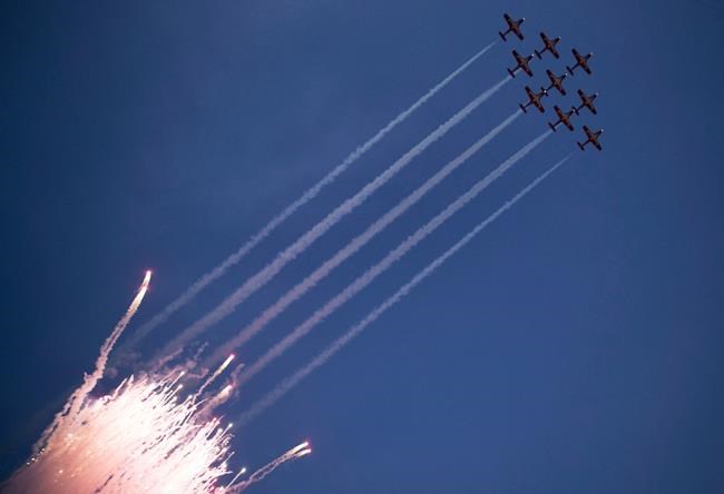 The Canadian Forces Snowbirds fly over the stadium at the start of the 106th Grey Cup in Edmonton on November 25, 2018. A military investigation has found that the ejection seat of one of the military's iconic Snowbirds planes tangled with the pilot's parachute as he tried to escape from the aircraft before it crashed in the U.S. state of Georgia last year. THE CANADIAN PRESS/Darryl Dyck