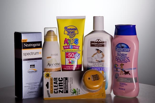 Various sunscreen products are seen in Washington on May 26, 2010. Having your home-office space next to a large window can be great for your mood, your eyes and your productivity. But if the sun is shining through, it could be harmful to your skin. Experts in dermatology say wearing a broad-spectrum sunscreen -- even while indoors -- is necessary to block out the UVA rays that might not visibly tan your skin as well as UVB, but will play a role in damaging it. THE CANADIAN PRESS/AP - Evan Vucci