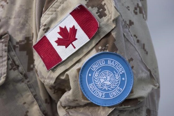 Canadian flag and the UN flag is shown on the sleeve of a Canadian soldier's uniform before boarding a plane at CFB Trenton in Trenton, Ont., on July 5, 2018. Canada's contribution to peacekeeping has reached what is believed to be an all-time low, even as the Liberal government makes its final push to secure a coveted seat on the United Nations Security Council. UN figures show there were 35 Canadian military and police officers deployed on peacekeeping operations at the end of April. That represented the smallest number since at least 1956, according to Walter Dorn, a peacekeeping expert at the Canadian Forces College in Toronto. THE CANADIAN PRESS/Lars Hagberg