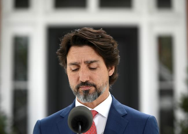 Prime Minister Justin Trudeau pauses during his daily news conference on the COVID-19 pandemic outside his residence at Rideau Cottage in Ottawa, on Tuesday, May 19, 2020. THE CANADIAN PRESS/Justin Tang