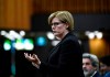 Minister of Employment, Workforce Development and Disability Inclusion Carla Qualtrough rises in the House of Commons on Parliament Hill in Ottawa, as Parliament was recalled for the consideration of measures related to the COVID-19 pandemic, on Saturday, April 11, 2020. THE CANADIAN PRESS/Justin Tang