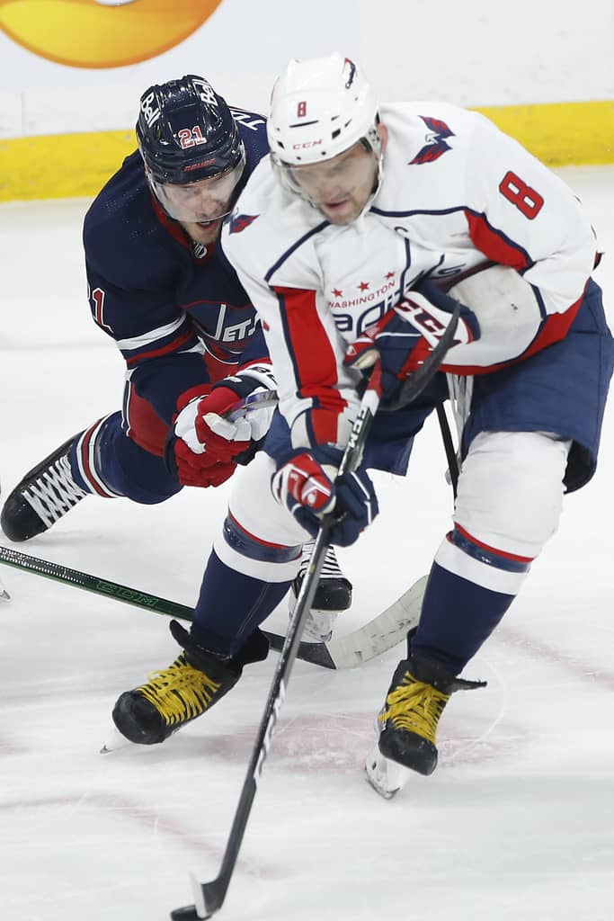 THE CANADIAN PRESS/John Woods
Winnipeg Jets' Dominic Toninato hooks Washington Capitals' Alex Ovechkin during the first period.