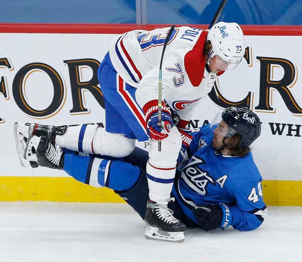 CP
Winnipeg Jets' Josh Morrissey and Montreal Canadiens' Tyler Toffoli collide during the second period. THE CANADIAN PRESS/John Woods
