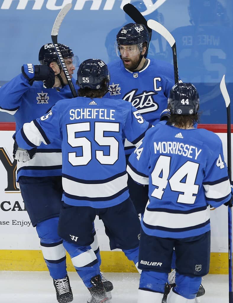 CP
Winnipeg Jets' Paul Stastny, Mark Scheifele, Blake Wheeler, and Josh Morrissey celebrate Wheeler's first period goal against the Montreal Canadiens. THE CANADIAN PRESS/John Woods