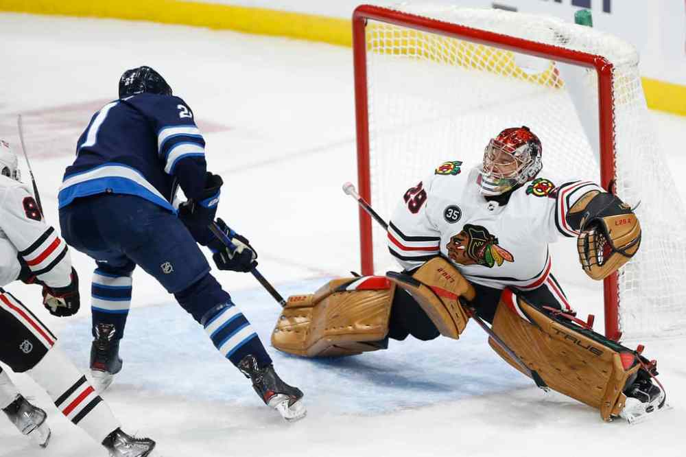 CP
Winnipeg Jets' Dominic Toninato scores on Chicago Blackhawks goaltender Marc-Andre Fleury during the second period. THE CANADIAN PRESS/John Woods