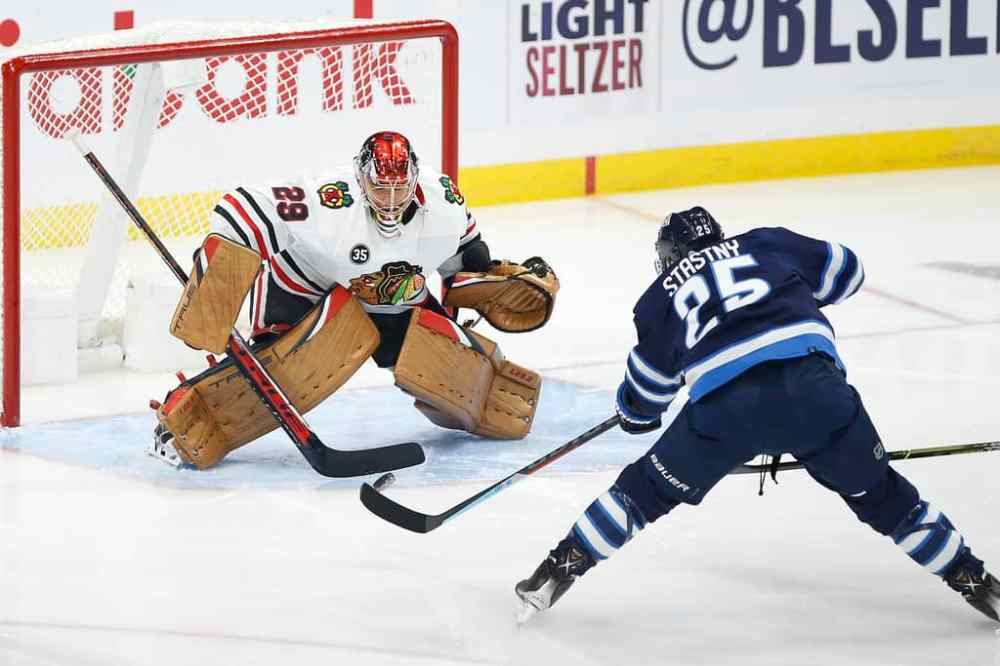 CP
Winnipeg Jets' Paul Stastny scores on Chicago Blackhawks goaltender Marc-Andre Fleury in the first period. THE CANADIAN PRESS/John Woods