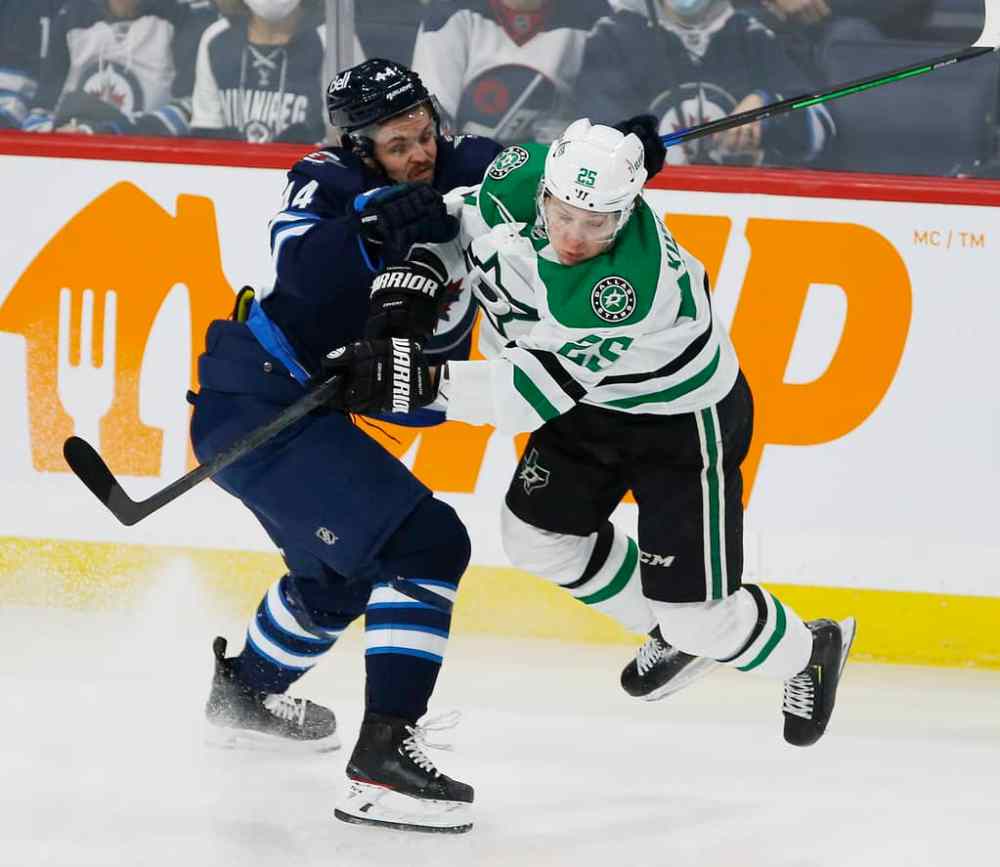 JOHN WOODS / WINNIPEG FREE PRESS
Winnipeg Jets’ Josh Morrissey checks Dallas Stars' Joel Kiviranta during the first period.