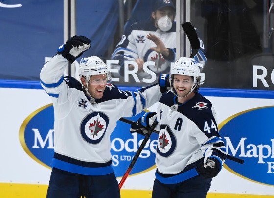 Winnipeg Jets defenceman Josh Morrissey, right, celebrates his goal with teammate Paul Stastny  while playing against the Toronto Maple Leafs during the second period in Toronto on Tuesday. THE CANADIAN PRESS/Nathan Denette
