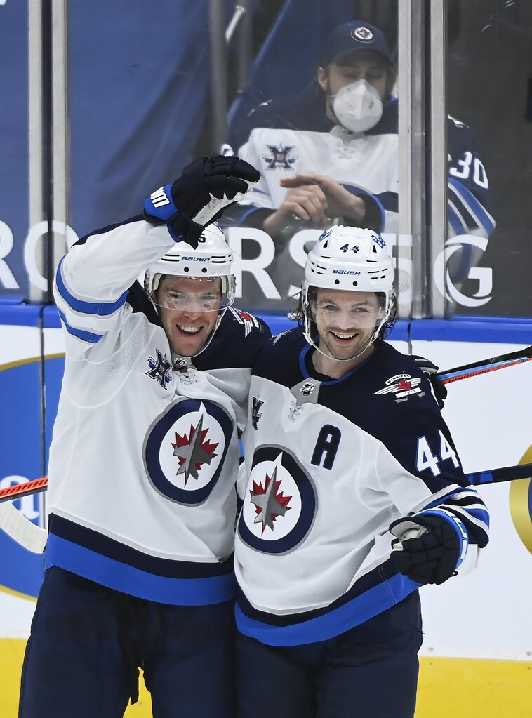 Winnipeg Jets defenceman Josh Morrissey, right, celebrates his goal with teammate Paul Stastny during the second period. THE CANADIAN PRESS/Nathan Denette