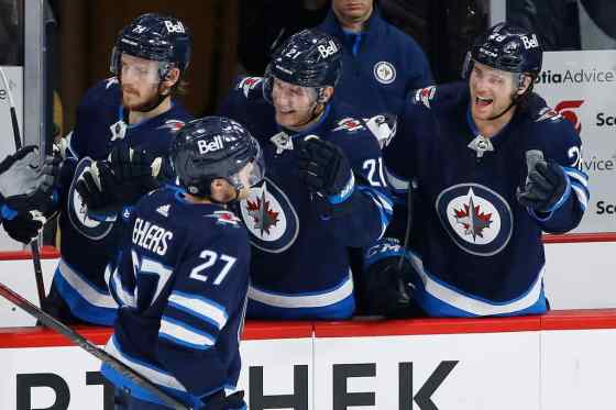 CPWinnipeg Jets' Nikolaj Ehlers celebrates his second goal of the night against the Calgary Flames with Evgeny Svechnikov, Dominic Toninato and Nathan Beaulieu in the third period  on Wednesda. THE CANADIAN PRESS/John Woods