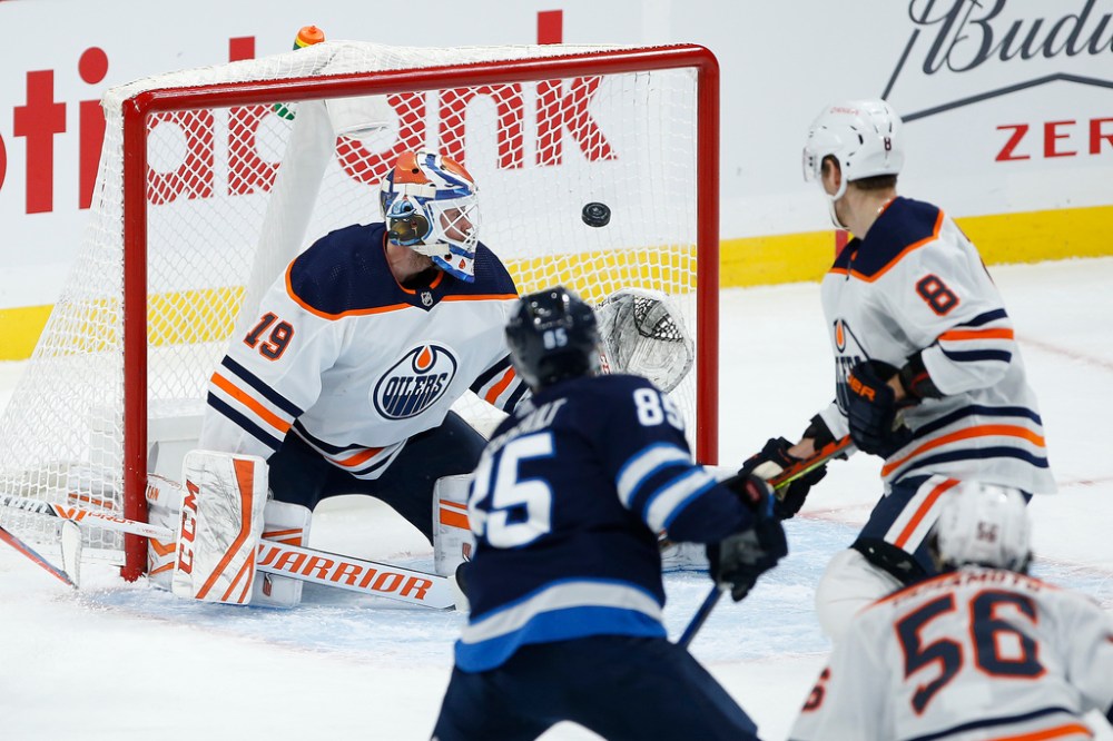 JOHN WOODS / WINNIPEG FREE PRESS
Winnipeg Jets’ Mathieu Perreault scores on Edmonton Oilers goaltender Mikko Koskinen during the first period Tuesday.