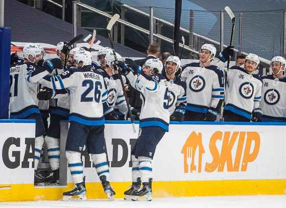 CPWinnipeg Jets celebrate a goal against the Edmonton Oilers during the third period. THE CANADIAN PRESS/Jason Franson