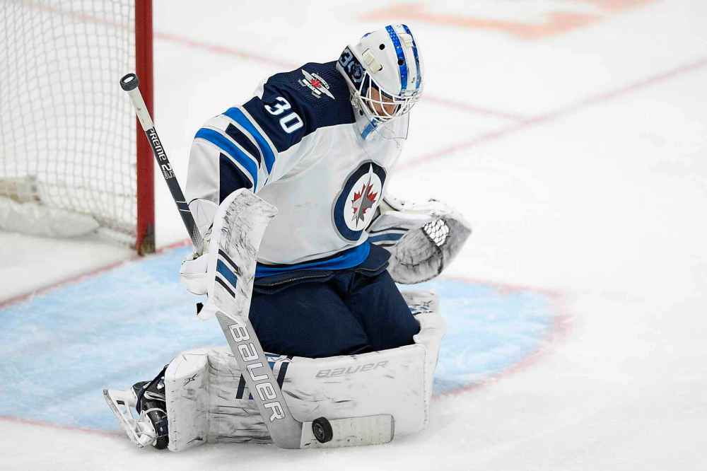CP
Winnipeg Jets goaltender Laurent Brossoit stops the puck during the third period of the team's NHL hockey game against the Washington Capitals, Tuesday, Feb. 25, 2020, in Washington. The Capitals won 4-3 in a shootout. (AP Photo/Nick Wass)
