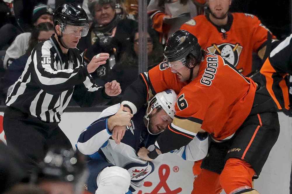 (AP Photo/Chris Carlson)
Anaheim Ducks defenceman Erik Gudbranson, right, fights with Winnipeg Jets defenceman Anthony Bitetto during the first period in Anaheim, Friday.
