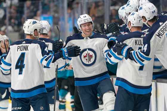 (AP Photo/Tony Avelar)Winnipeg Jets centre David Gustafsson is congratulated by teammates after scoring his first NHL goal against the Sharks in San Jose, Wednesday.