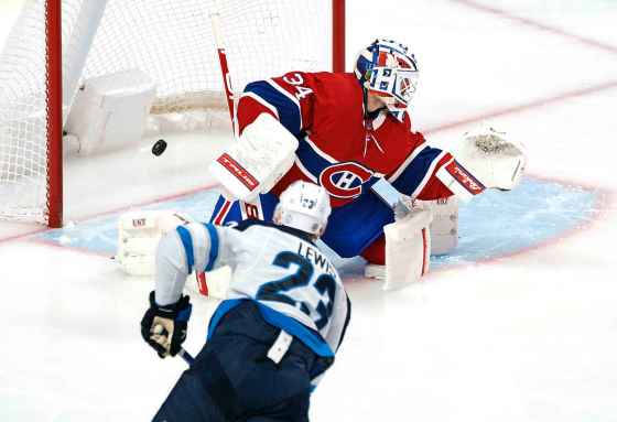 CPWinnipeg Jets' Trevor Lewis scores one of his two goals of the game against Montreal Canadiens goaltender Jake Allen during the second period. THE CANADIAN PRESS/Paul Chiasson