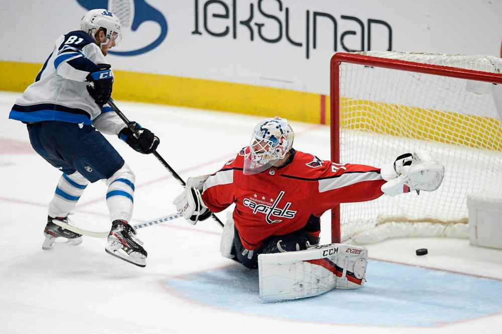 (AP Photo/Nick Wass)
Winnipeg Jets left wing Kyle Connor scores on Capitals goaltender Braden Holtby during the third period.