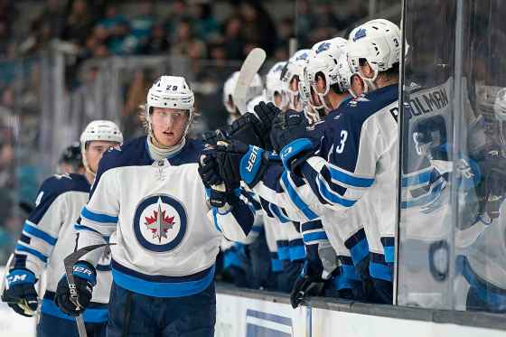 (AP Photo/Tony Avelar)Winnipeg Jets right wing Patrik Laine is congratulated by teammates after scoring a power play goal against the Sharks during the first period Wednesday.