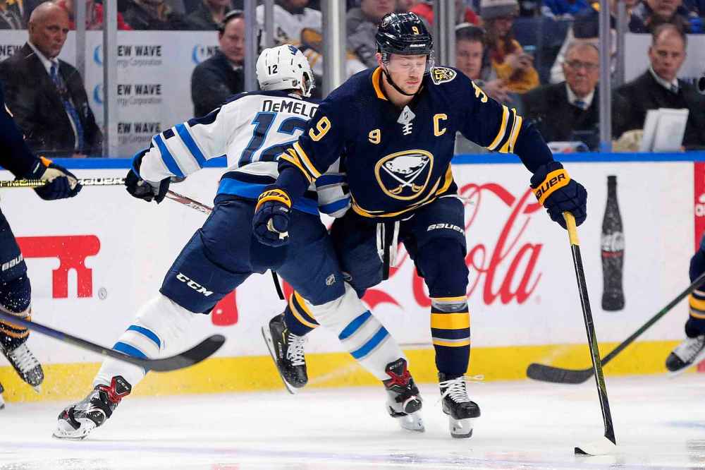 (AP Photo/Jeffrey T. Barnes)
Buffalo Sabres forward Jack Eichel is checked by Winnipeg Jets defenseman Dylan DeMelo Sunday in the Jets disheartening 2-1 loss to the Sabres. The Jets generated no shots on goal in the final nine minutes of the game.
