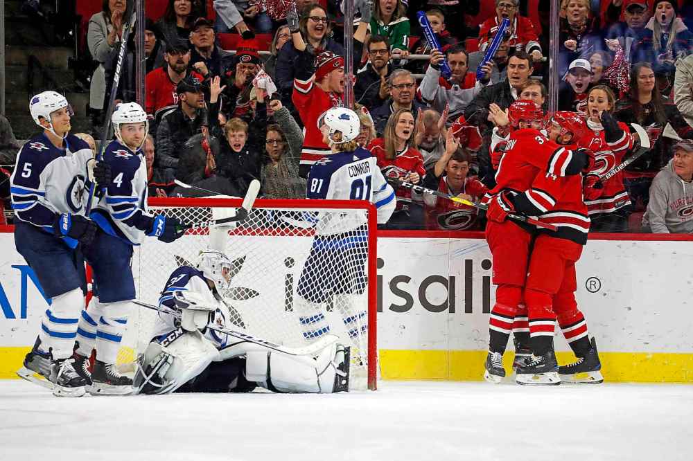 (AP Photo/Karl B DeBlaker)
Carolina Hurricanes' Justin Williams, right, is congratulated on his second goal of the game by teammate Andrei Svechnikov during the third period against the Winnipeg Jets Tuesday.