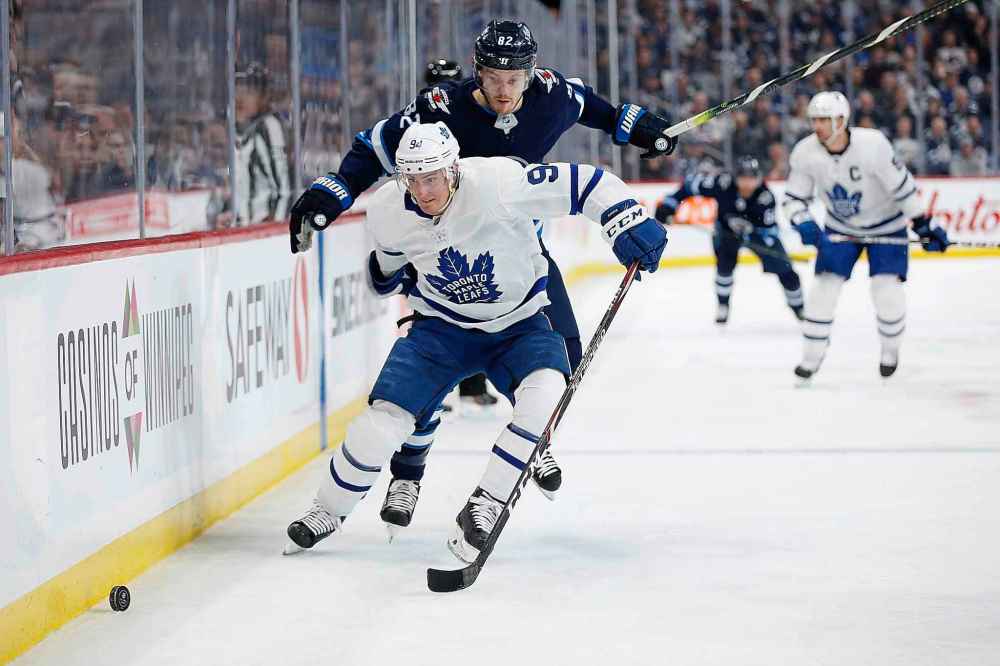 THE CANADIAN PRESS/John Woods
Winnipeg Jets' Mason Appleton can't get around Toronto Maple Leafs' Tyson Barrie during the second period.