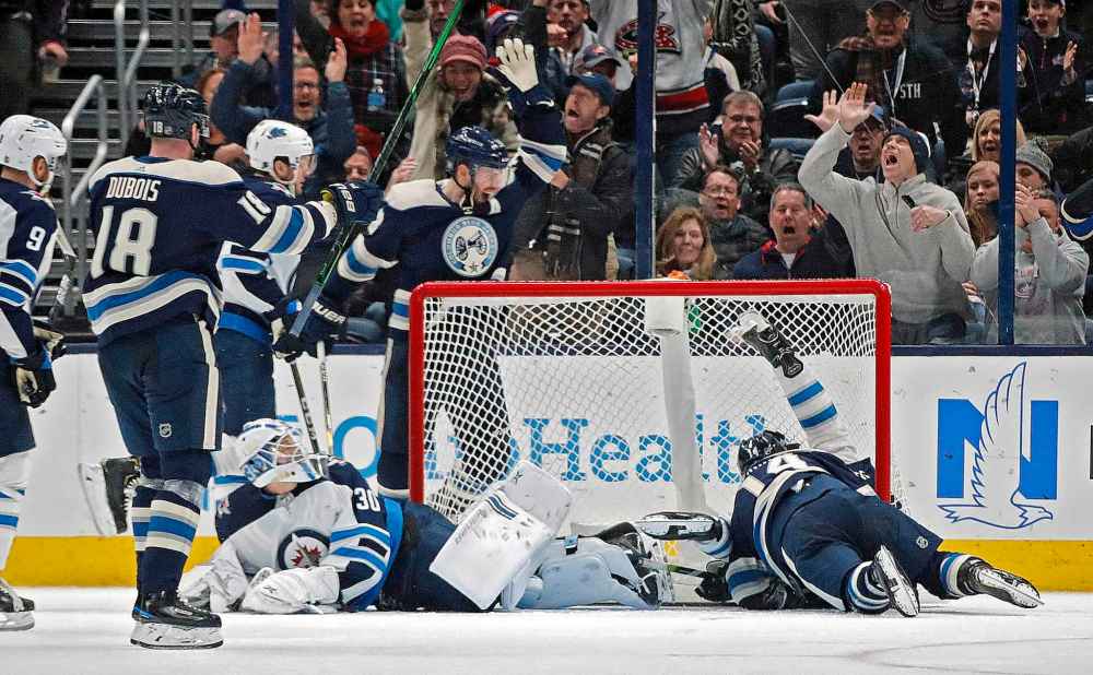 (Kyle Robertson/Columbus Dispatch/TNS)
The Columbus Blue Jackets' Gustav Nyquist scores after diving to poke the puck across the goal line against the Winnipeg Jets in the second period at Nationwide Arena in Columbus, Ohio, on Wednesday.
