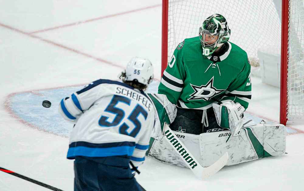 (AP Photo/Brandon Wade)
Dallas Stars goaltender Ben Bishop deflects a shot by Winnipeg Jets forward Mark Scheifele during the first period Thursday in Dallas.