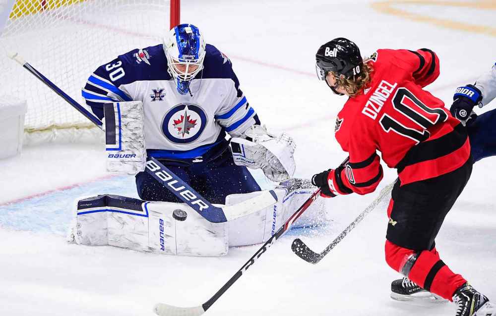 CP
Winnipeg Jets goaltender Laurent Brossoit makes a save on Ottawa Senators' Ryan Dzingel during the second period. THE CANADIAN PRESS/Sean Kilpatrick