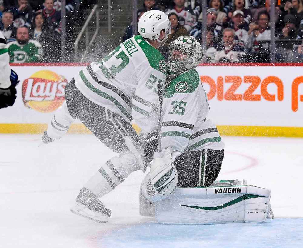 THE CANADIAN PRESS/Fred Greenslade
Dallas Stars' Esa Lindell collides with goaltender Anton Khudobin during the second period.