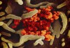This undated electron microscope image made available by the U.S. National Institutes of Health in February 2020 shows the Novel Coronavirus SARS-CoV-2, orange, emerging from the surface of cells, green, cultured in the lab. Also known as 2019-nCoV, the virus causes COVID-19. The sample was isolated from a patient in the U.S. THE CANADIAN PRESS/AP, NIAID-RML